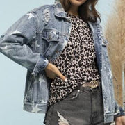 Light wash denim trucker jacket with white stars and distressed details.