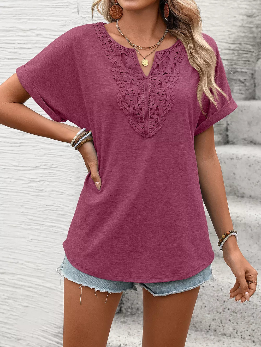 Burgundy lace-trimmed relaxed fit t-shirt with short sleeves and a V-neck.