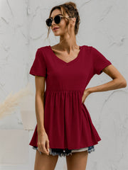 Burgundy v-neck tee with gathered waistline and short sleeves