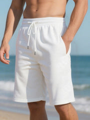 Men's white relaxed fit chino shorts with drawstring and geometric pattern