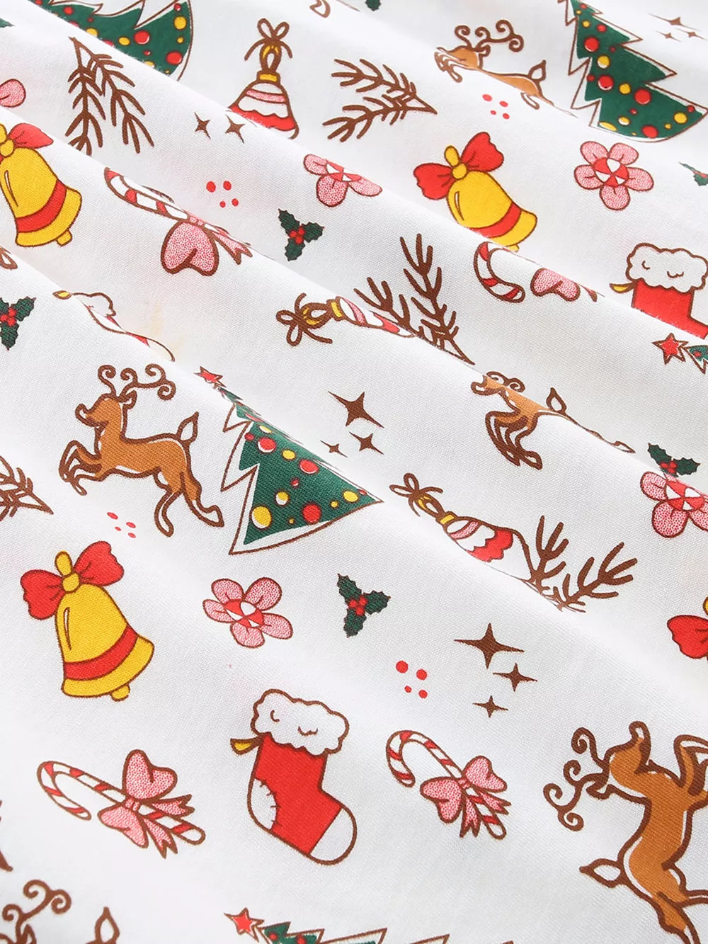 Festive ruffled cotton dress for toddlers with Christmas print featuring bells, candy canes, and reindeer.