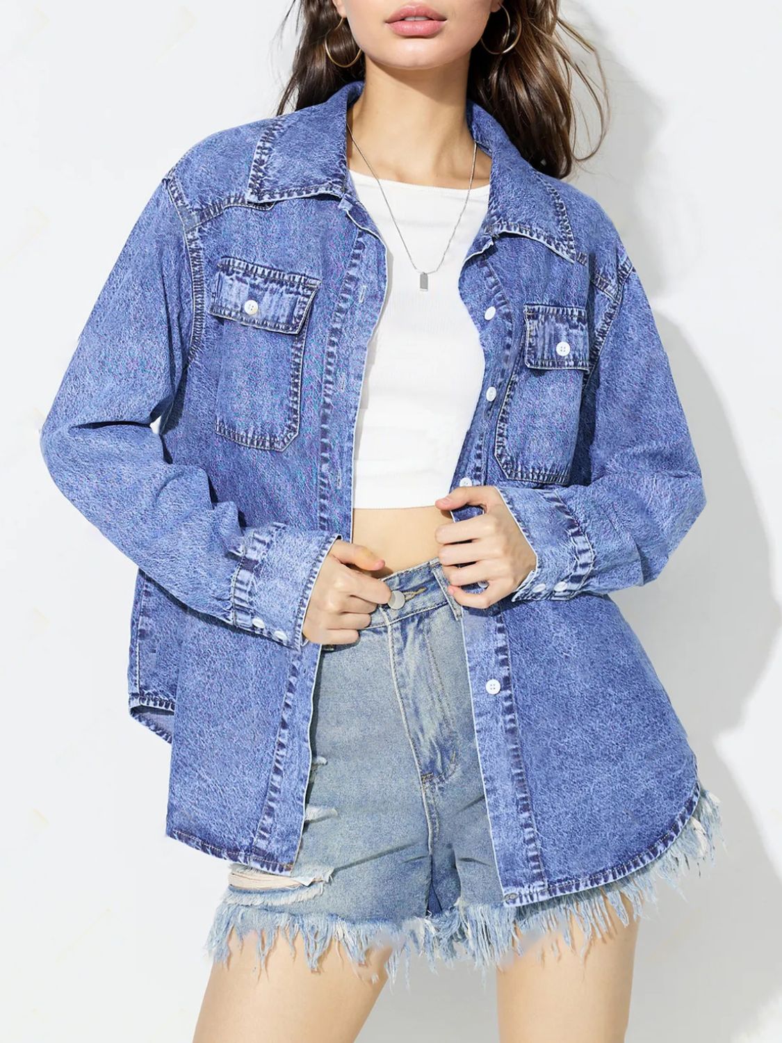 Acid wash denim overshirt in medium blue with two chest pockets and button front.