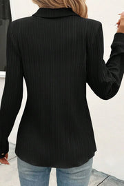 Black textured ribbed button-down shirt with long sleeves.