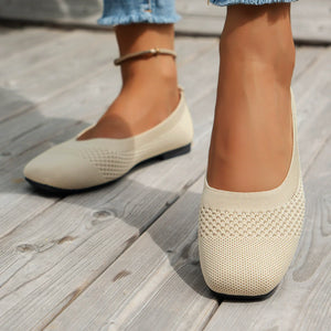 Beige knit square-toe flats with breathable texture.