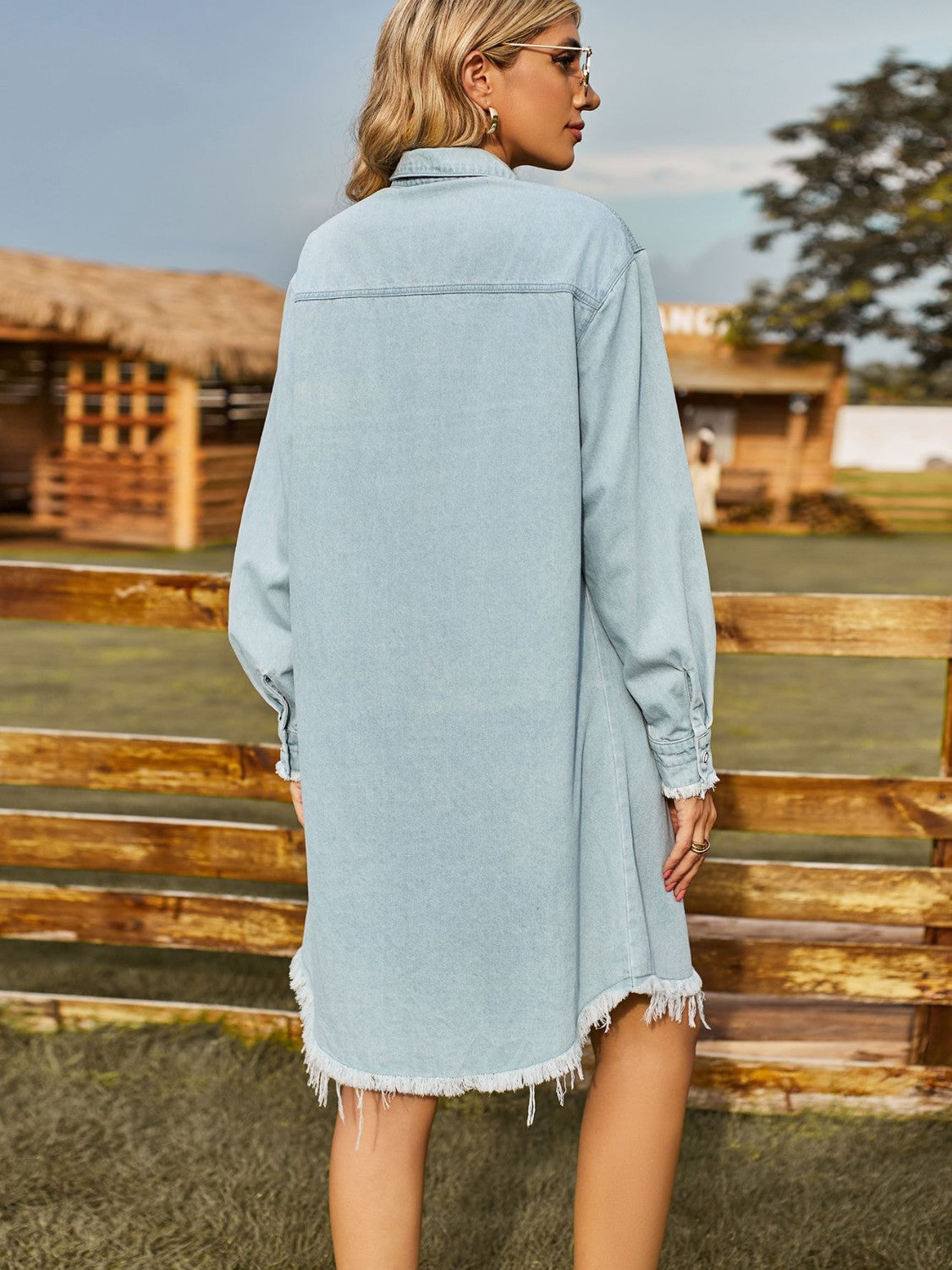 Light wash denim shirt dress with frayed hem and cuffs.
