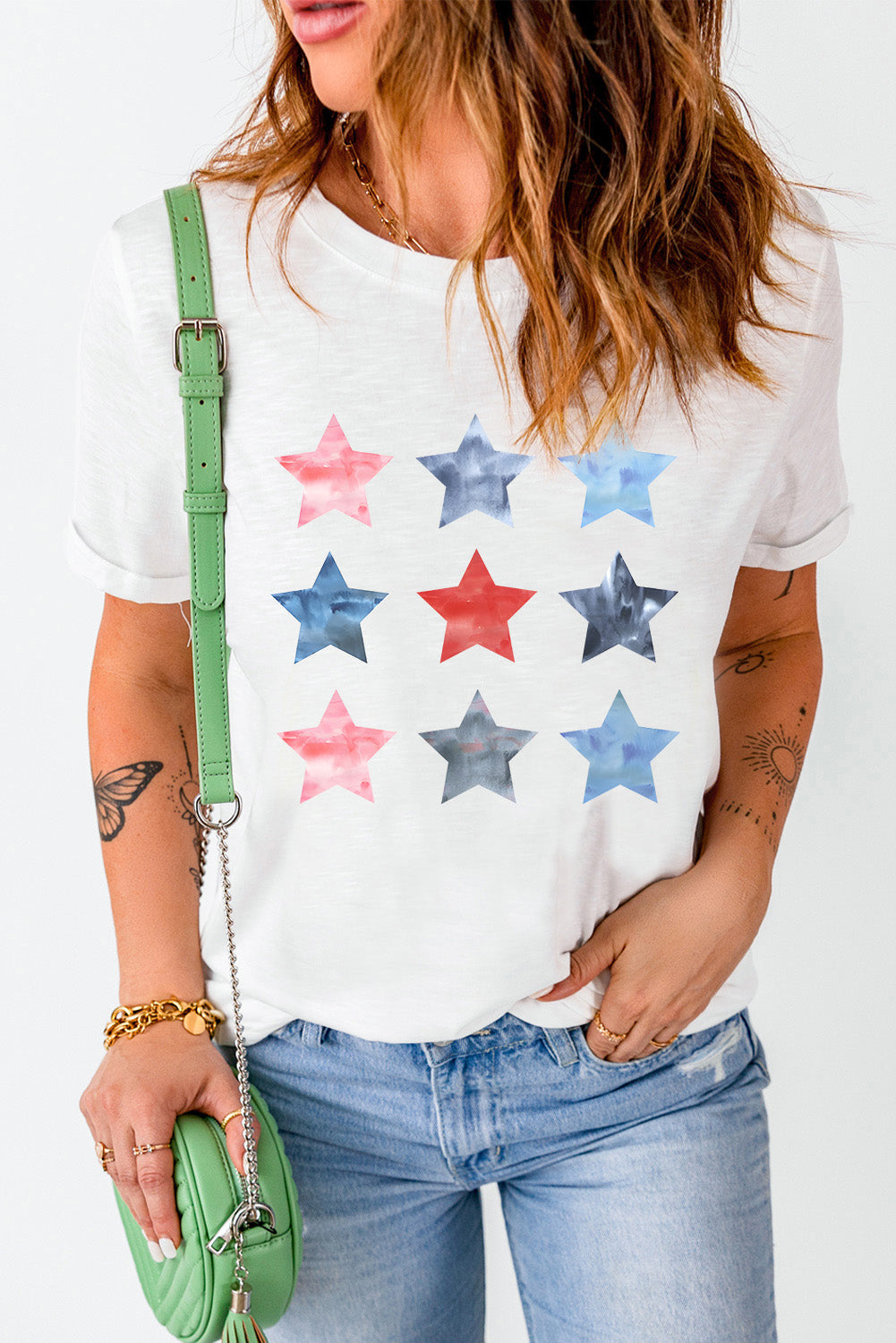 White crewneck tee with a watercolor starburst pattern in red, blue, and gray.