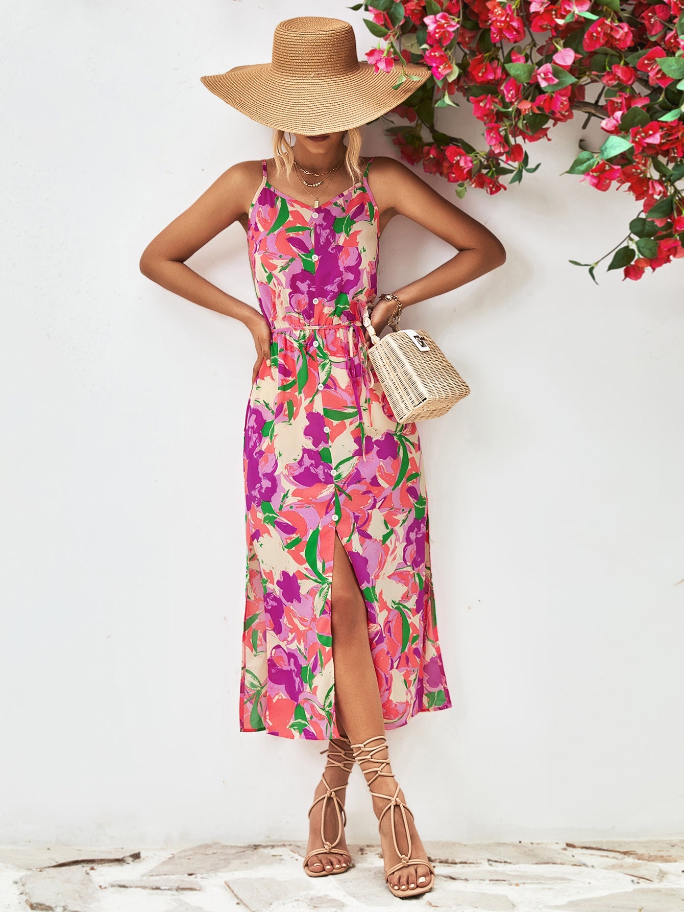 Floral print button-down midi dress with spaghetti straps and a high slit.
