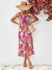 Floral print button-down midi dress with spaghetti straps and a high slit.