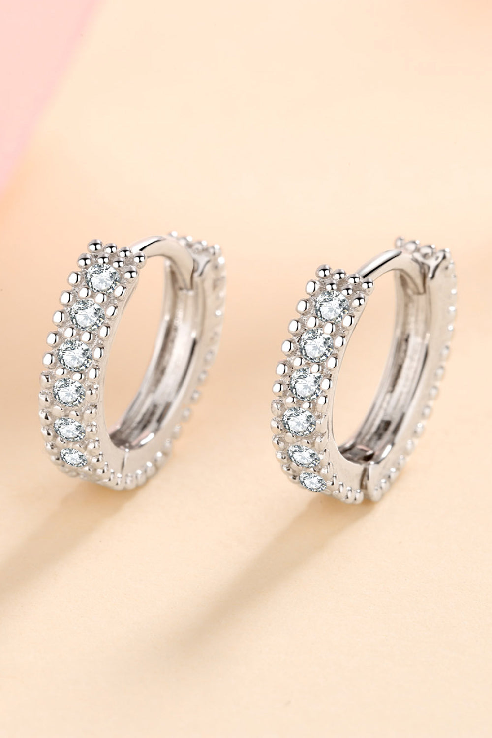 Silver pavé and beaded hoop earrings with clear stones