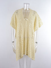 Cream open-knit V-neck beach cover-up with short sleeves and a relaxed fit.