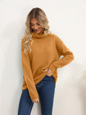 Textured knit oversized turtleneck pullover in mustard acrylic with a relaxed fit.