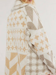 Geometric patchwork knit cardigan in cream and tan with a hooded neckline.