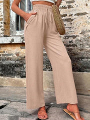 Drawstring linen palazzo trousers in khaki with button detail pockets.