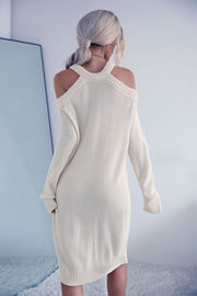 Cream knit halter cold shoulder dress with long sleeves and a ribbed hem.