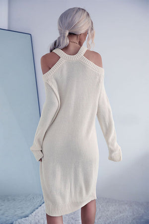 Cream knit halter cold shoulder dress with long sleeves and a ribbed hem.