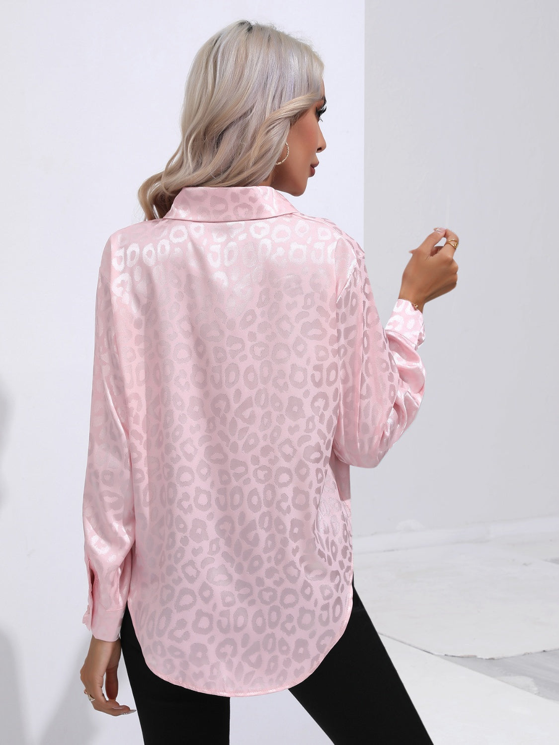 Blush pink satin button-down shirt with embossed leopard print and long sleeves.