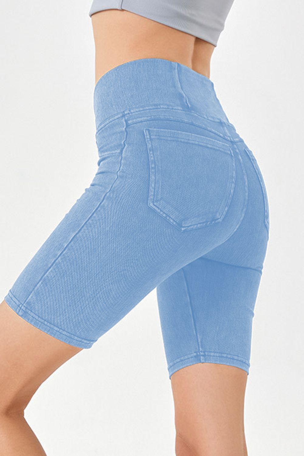 Peacock Blue denim bermuda shorts with crisscross waistband and back pockets.
