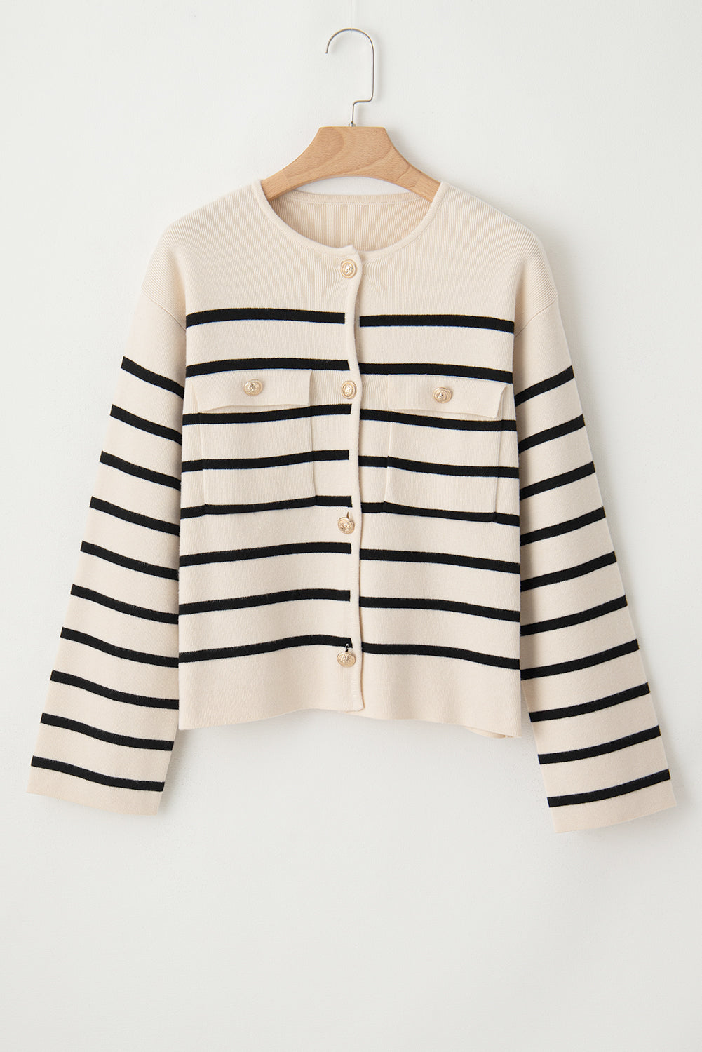 Beige knit cardigan with black nautical stripes, button-up front, and chest pockets.