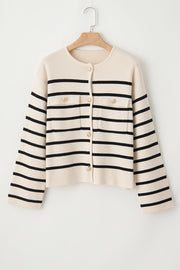 Beige knit cardigan with black nautical stripes, button-up front, and chest pockets.