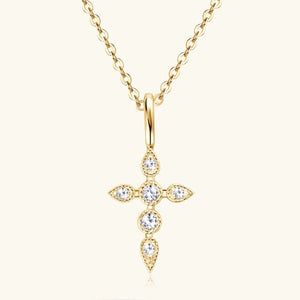 Gold diamond-set cross pendant necklace with a delicate chain.