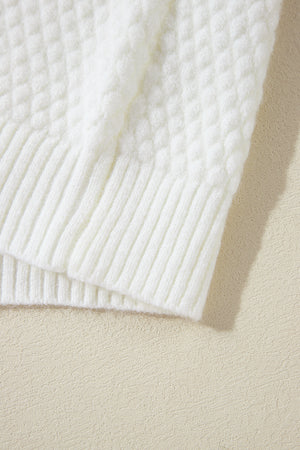 White knit sweater with diamond pattern and ribbed trim.