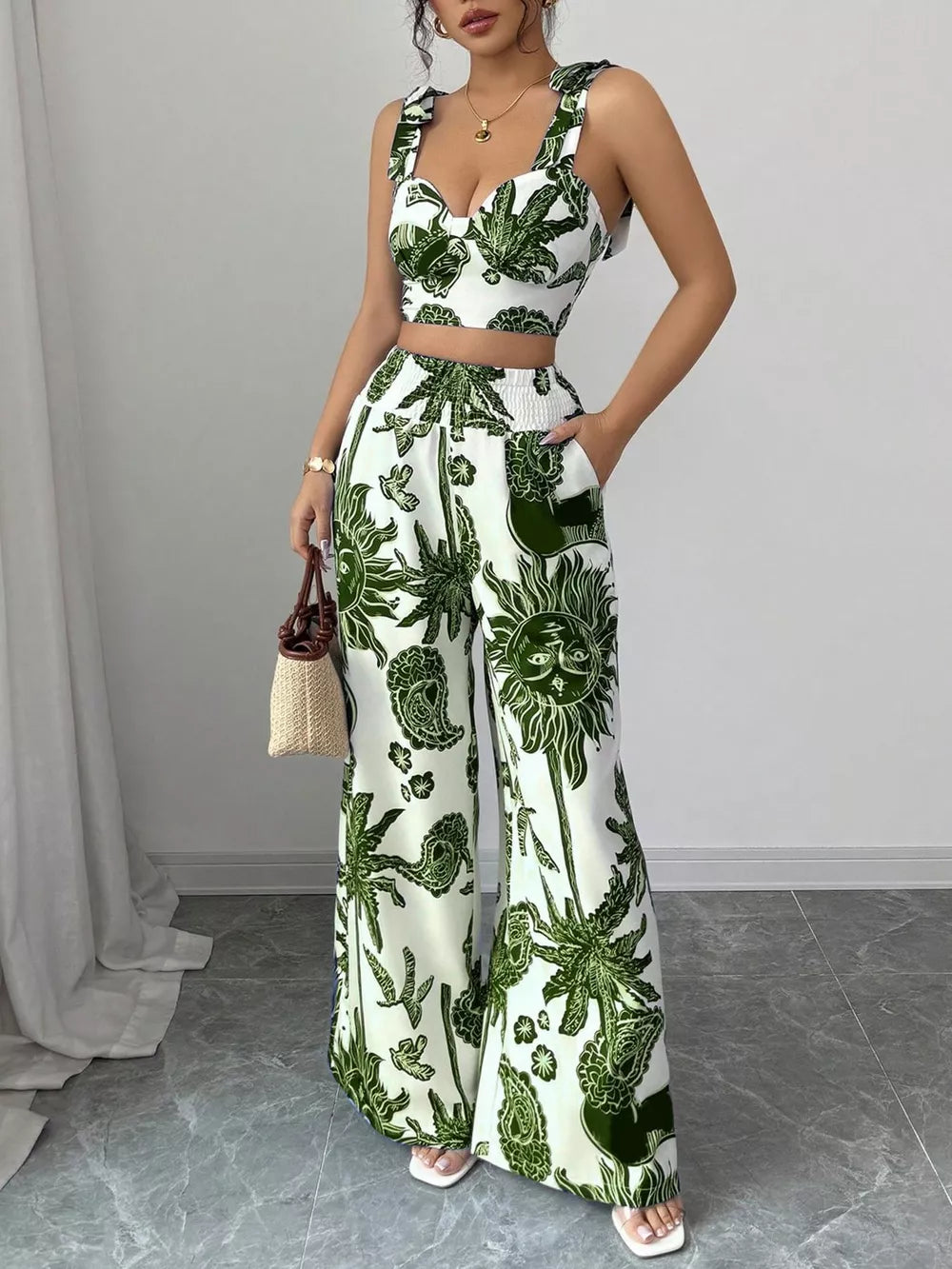 White and green tropical print crop top and wide-leg pants set with tie straps.