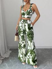 White and green tropical print crop top and wide-leg pants set with tie straps.