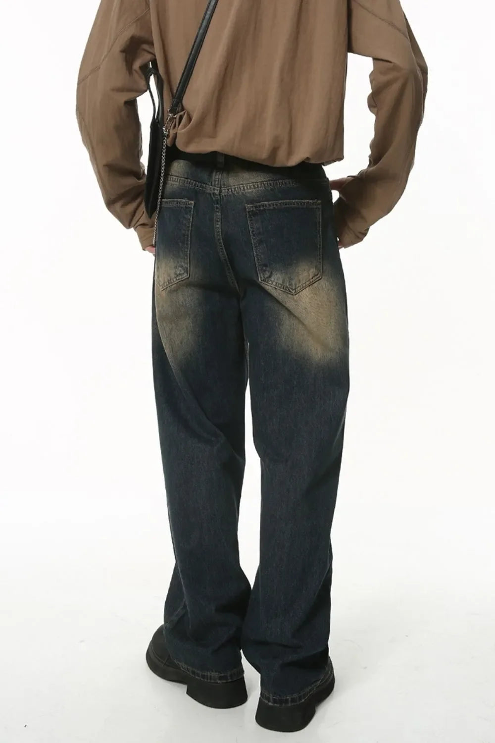Faded wash baggy denim jeans in dark wash with a relaxed fit.