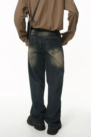 Faded wash baggy denim jeans in dark wash with a relaxed fit.