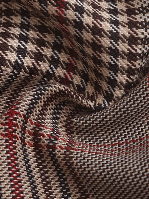 High-waisted plaid trousers in taupe with a houndstooth pattern and red accents.