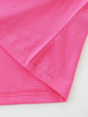 Bright pink cotton toddler t-shirt showing seam details and hem.