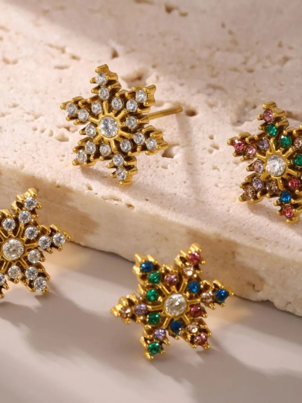 Celestial Gemstone Snowflake Studs in white and mixed color, 18K gold-plated earrings with clear and colorful gemstones.