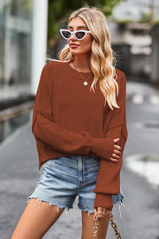 Cropped ribbed knit sweater in caramel with batwing sleeves and crewneck.