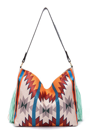 Southwestern fringe hobo bag with geometric pattern and mint green fringe detail.