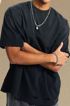 Black oversized t-shirt with distressed hemline and neckline details.