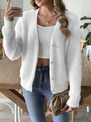 White plush button-down cardigan with pearl details and long sleeves.