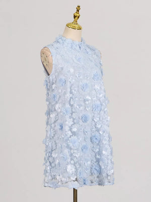 Blue ruffled floral applique mini dress with mock neck and sleeveless design.