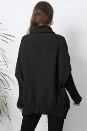 Black ribbed turtleneck sweater with batwing sleeves and cuffed hem.