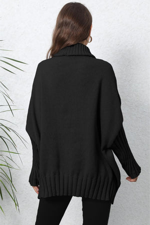 Black ribbed turtleneck sweater with batwing sleeves and cuffed hem.
