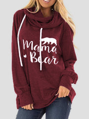 Burgundy cowl neck hoodie with white Mama Bear graphic and drawstring.