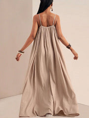 Khaki maxi swim dress with adjustable spaghetti straps and gathered bust detail.