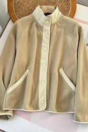Tan fleece bomber jacket with contrast trim and snap button closure