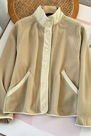 Tan fleece bomber jacket with contrast trim and snap button closure