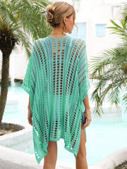 Green open-knit caftan cover-up with slits and a relaxed fit.