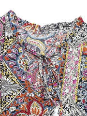 Paisley print midi dress with tie neck, ruffled collar, and decorative tassels.