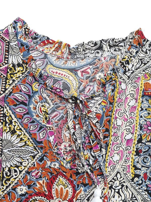 Paisley print midi dress with tie neck, ruffled collar, and decorative tassels.
