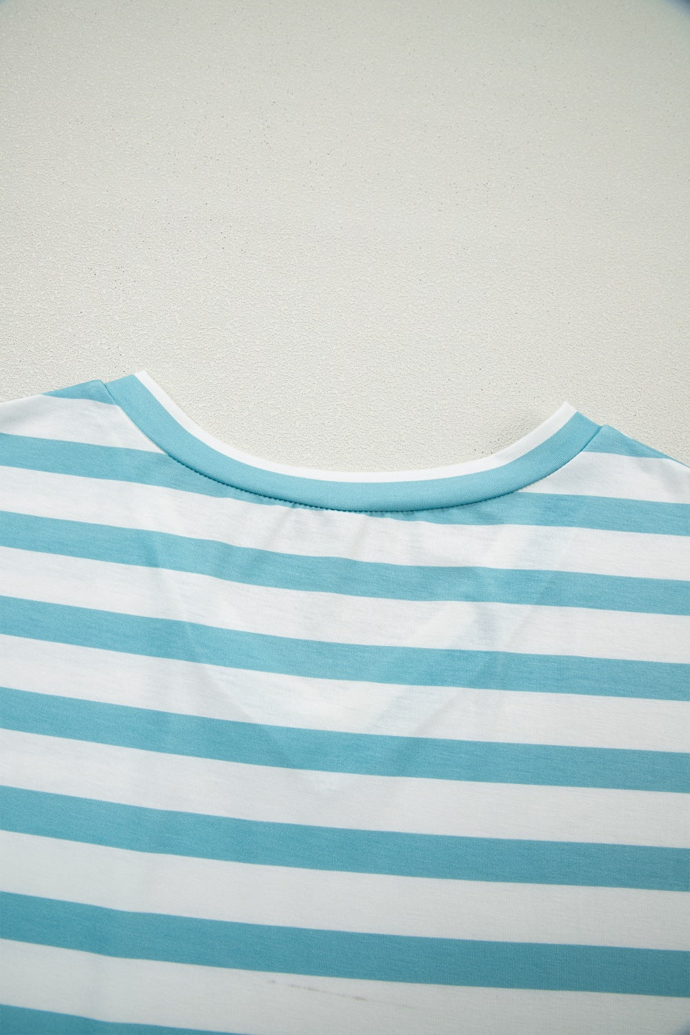 Striped teal and white V-neck t-shirt with elastane for comfort.