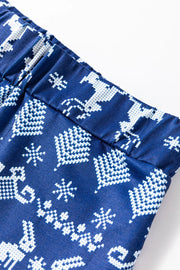 Navy loungewear set with festive white reindeer and snowflake print.