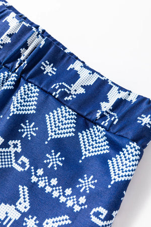 Navy loungewear set with festive white reindeer and snowflake print.