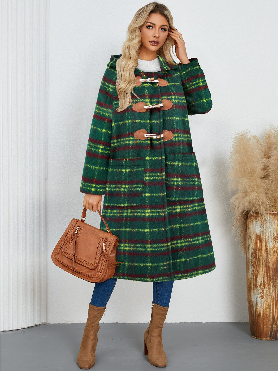 Dark green tartan toggle hooded coat with brown leather details and pockets.